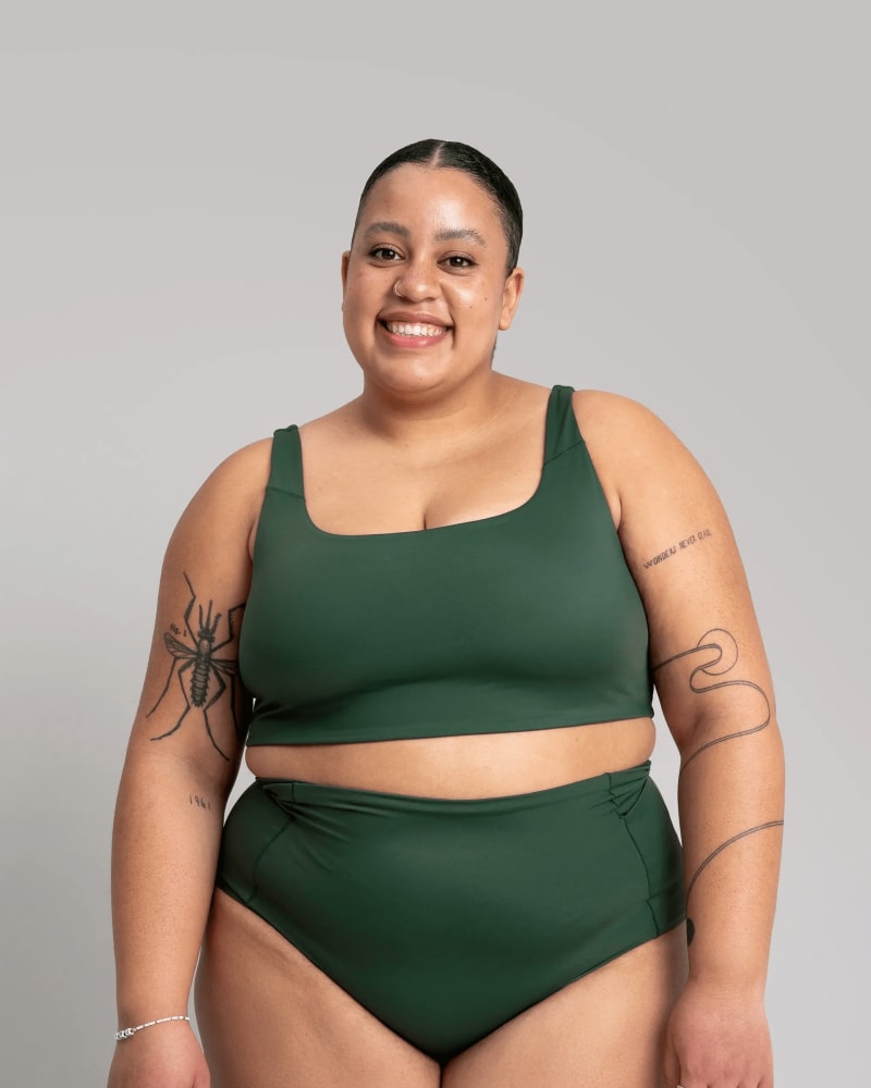 Front of a model wearing a size L surf's up swim bikini top in sycamore green by alder apparel. | dia_product_style_image_id:296264